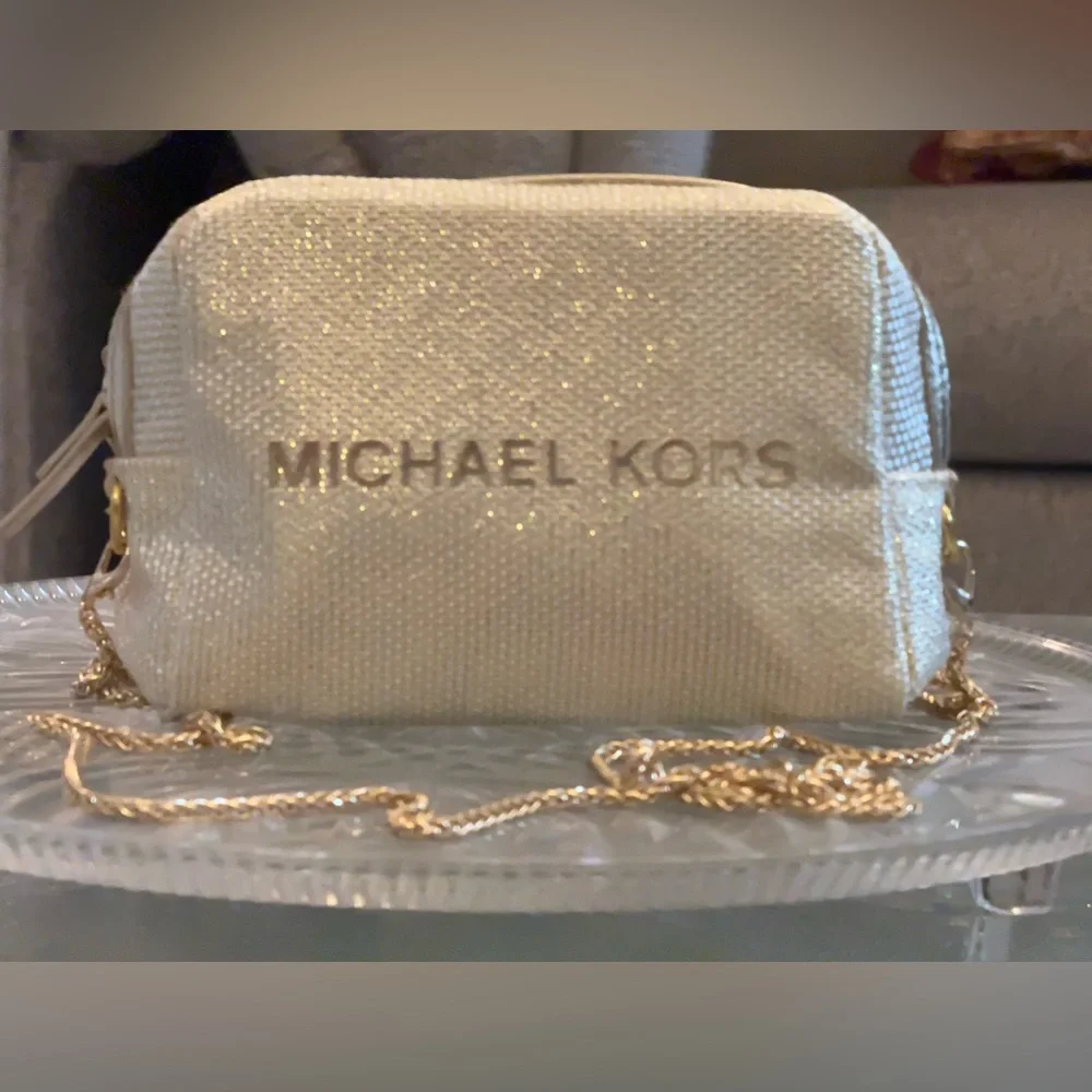 Michael Kors Shimmering Cream Gold Pouch with golden sling